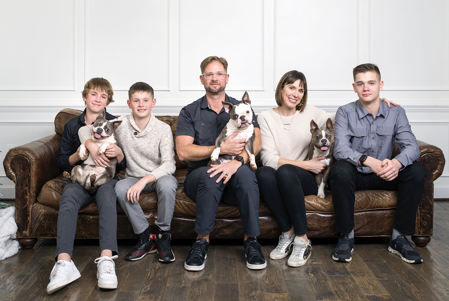 family picture on leather sofa