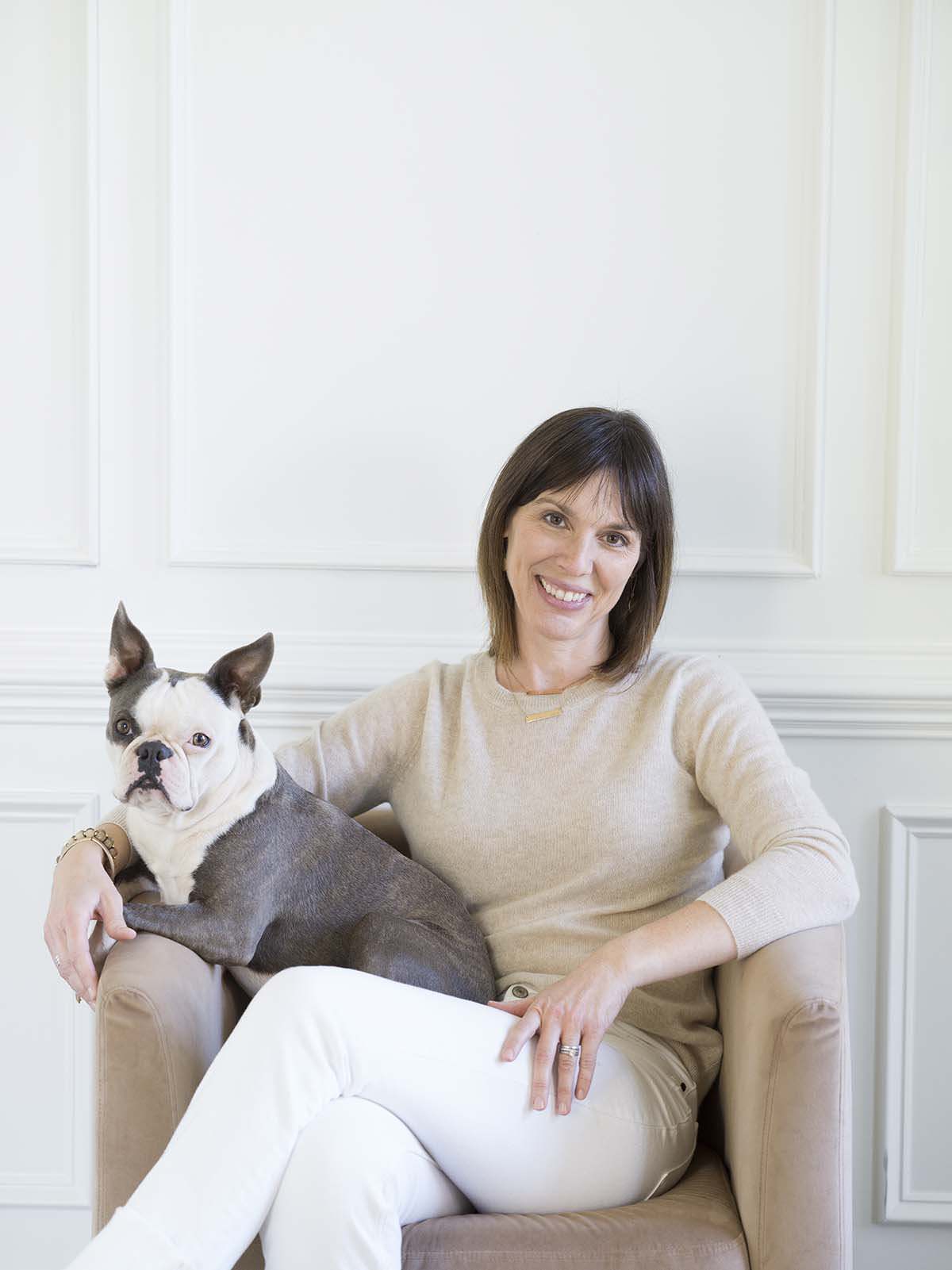 merriejoyinteriors headshot in chair with dog